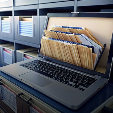 Digital resources top banner showing a modern workspace with laptop, tablet, and digital documents.